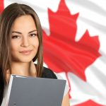 Girl Sitting in front of Canadian Flag